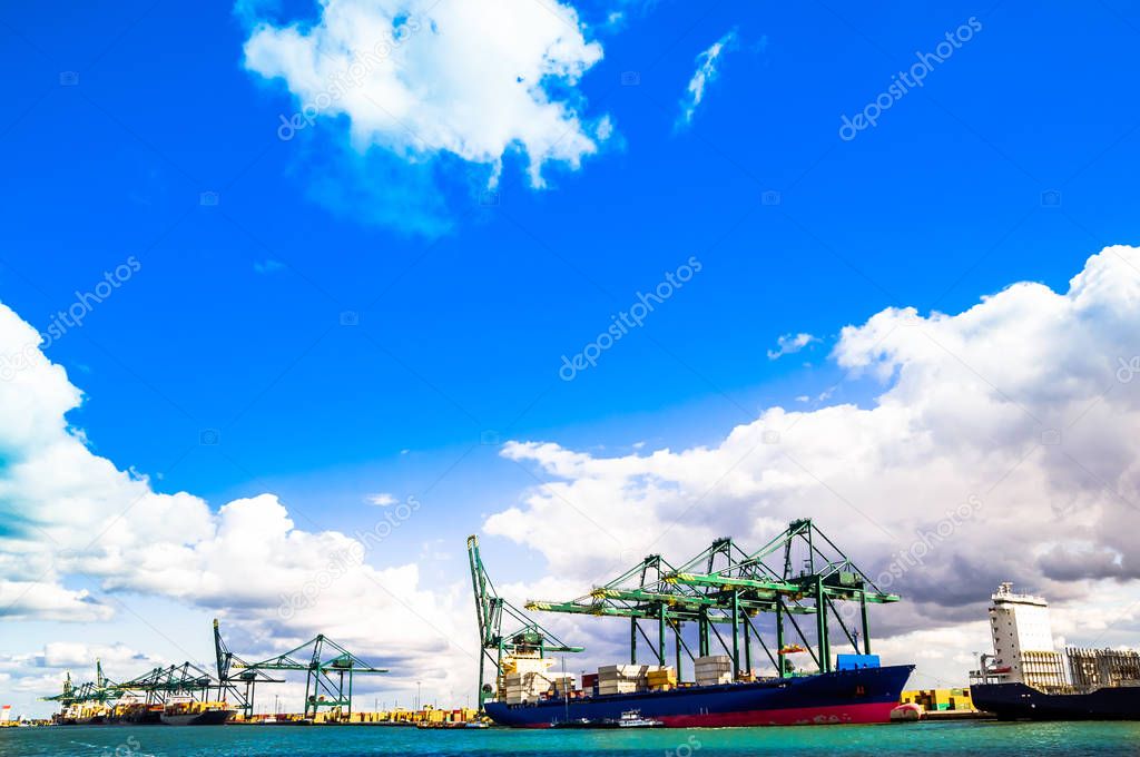Cargo cranes and ships in the harbor of Antwerp
