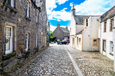 Alley with historical buildings in Culross Scotland clipart