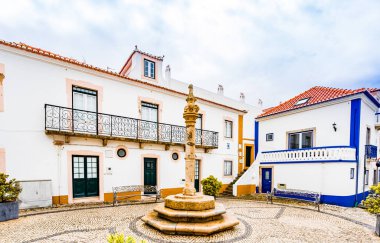 Streets of Ericeira, traditional white houses with blue stripes, Portugal clipart