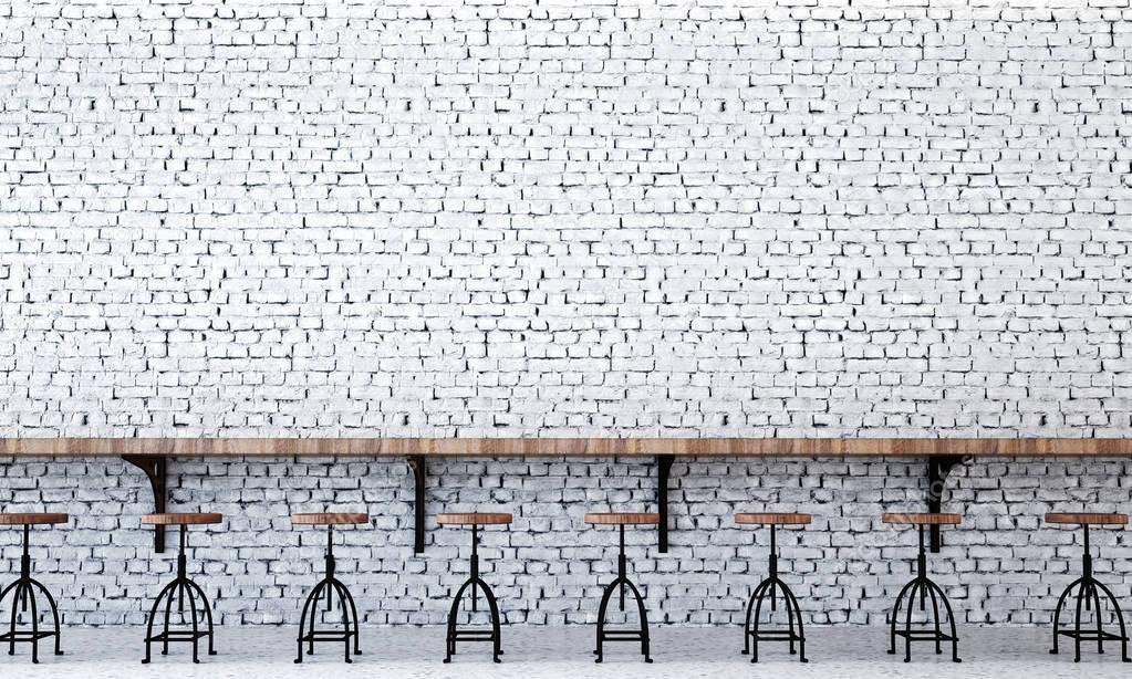 The industrial design interior of lounge bar and wooden chairs and white brick wall