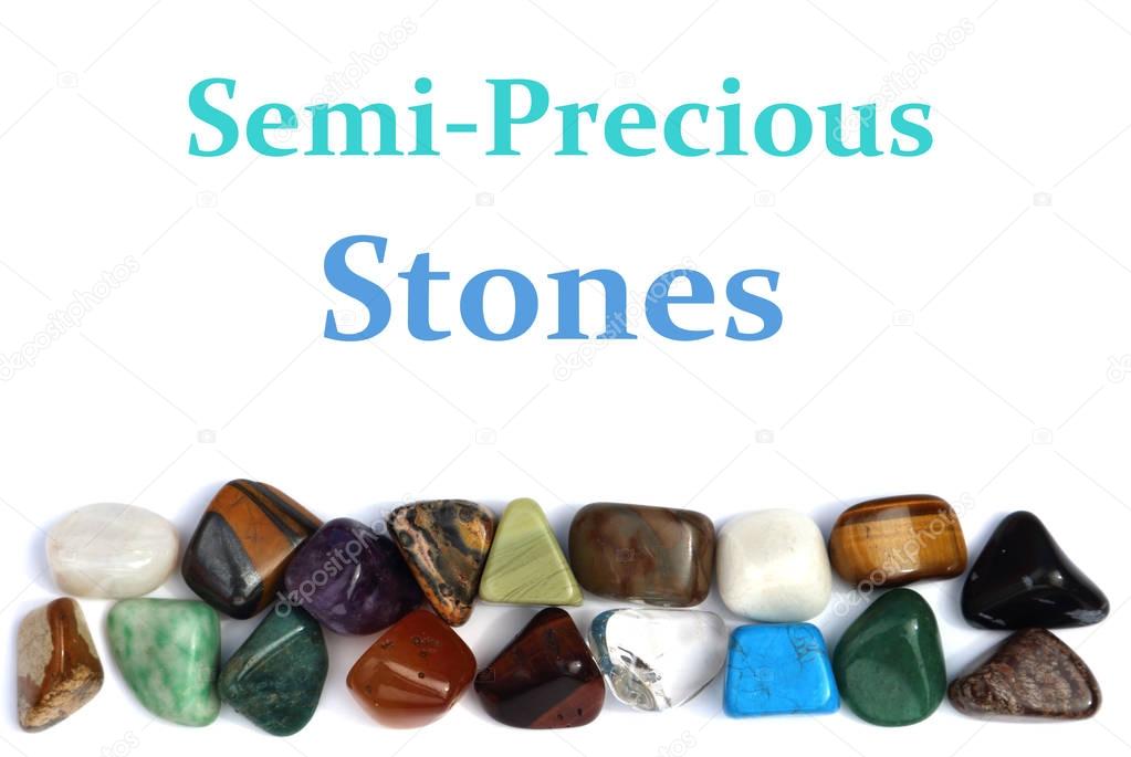 Closeup of various colorful stones over white background