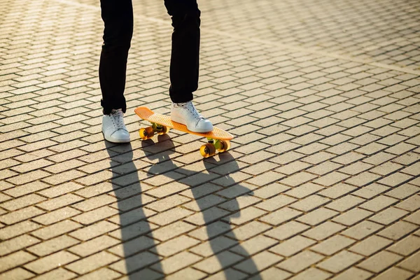 Hipster boy with skateboard outdoors. Closeup skateboarding. Act — Stock Photo, Image