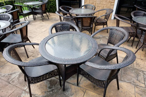 Chairs and tables of a restaurant seating outside