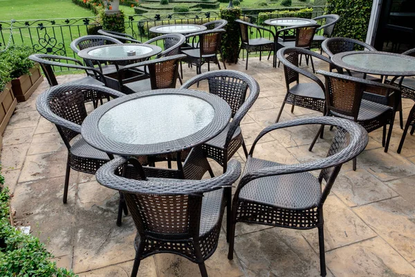 Chairs and tables of a restaurant seating outside