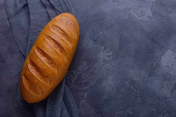 Fresh bread on stone table — Stock Photo, Image