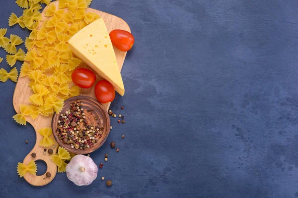 Pasta, cheese, tomatoes, spices — Stock Photo, Image