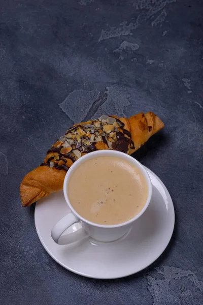 Cup cappuccino and croissant