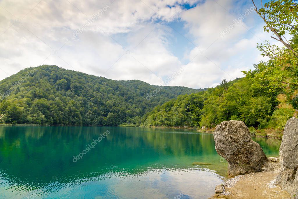 Beautiful view of blue lake in summer afternoon in Plitvice national park in Croatia