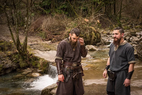 Two Vikings in the forest on the banks of the river — Stock Photo, Image