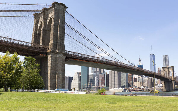 BROOKLYN, NYC - July 20: Brooklyn Bridge from Brooklyn Bridge Park, DUMBO, NYC seen on July 20, 2016. The park on the East River offers magnificent view of historic, landmark Brooklyn Bridge.