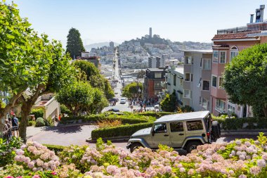 San Francisco USA - July 16, 2017 - Many vehicles drive downhill clipart