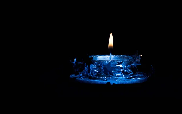 Christmas silver candle in blue — Stock Photo, Image