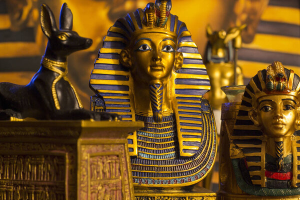 Still life of statues of king pharaoh tutankhamun tutankhamen and mythology jackal anubis inpu anup