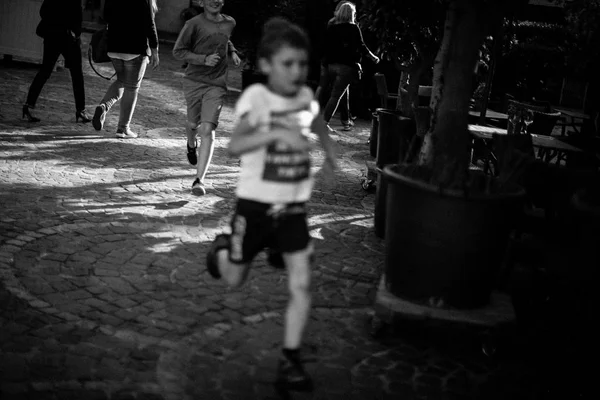 Two boys running at urban street — Stock Photo, Image