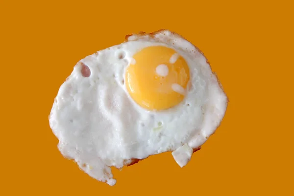 Fried egg on yellow — Stock Photo, Image