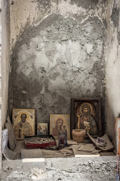 an abandoned church and an altar with small icons and money left. a Christian church and preserved icons. faith in God