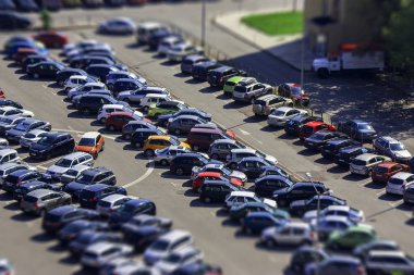 parking lot with many cars. there is no free parking space. urban landscape shot from high. large parking lot looking like a miniature. mini city. clipart