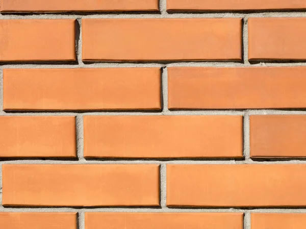 Orange tegel vägg bakgrund. — Stockfoto