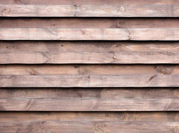 Egy fából készült kerítés egy új vízszintes barna háttér textúra — Stock Fotó