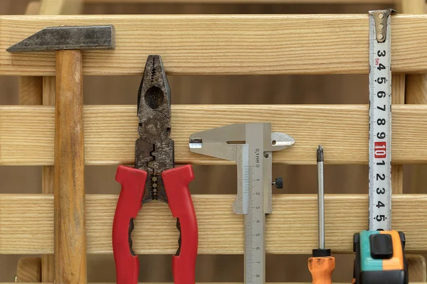 Old Construction tools on wooden slats close-up