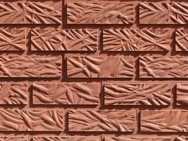 Fundo original de um tijolo vermelho figurado — Fotografia de Stock