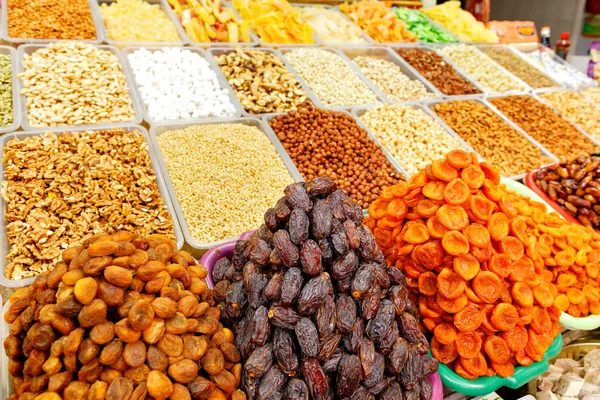 Dates, dried apricots, almonds, hazelnuts, walnuts, cashews are sold in the market.