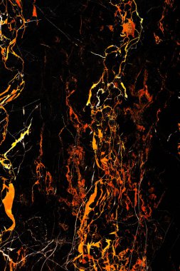 Mermer noktalar, donmuş lav gibi siyah mermer yüzeyde akar. Siyah ve ateşli mermer dokusu.