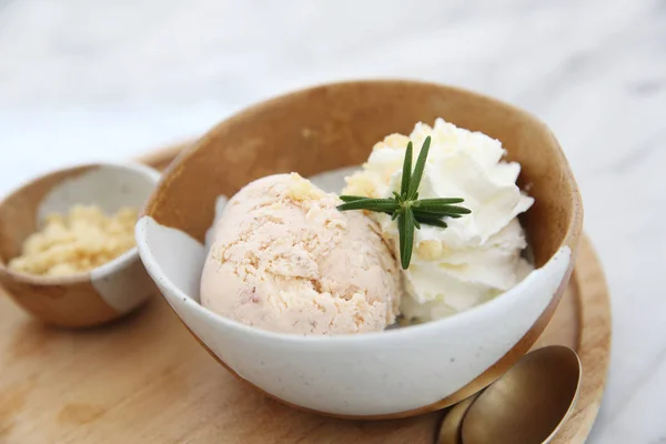 Ice cream with cream on wood — Stock Photo, Image