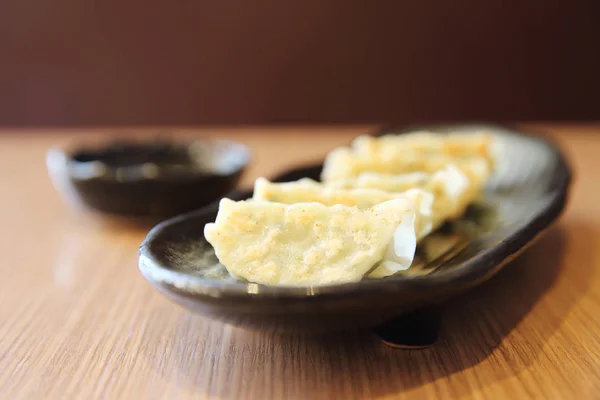 Gyoza on wood background — Stock Photo, Image