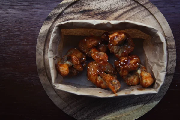 Buffalo wings on wood background — Stock Photo, Image