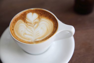 kapuçino ahşap arka plan üzerinde kahve