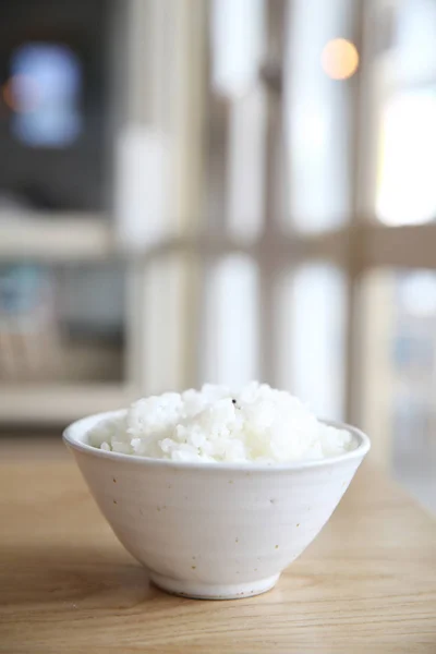 Rice on wood background — Stock Photo, Image