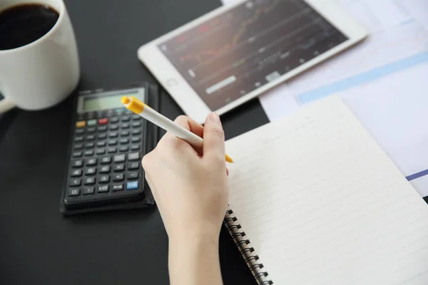 Office Woman hand Working on the Business Papers and tablet