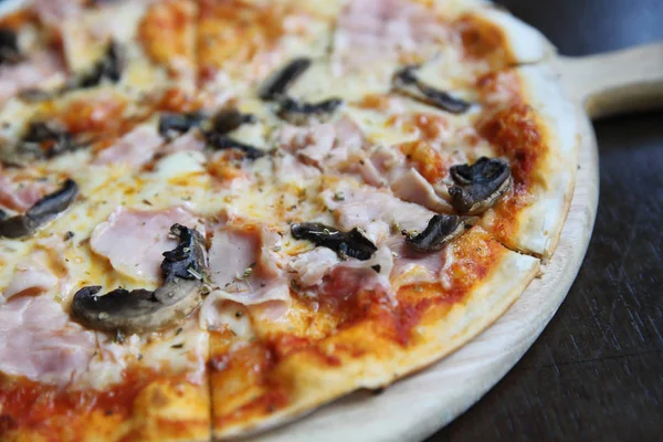 Pizza ham and mushroom on wood — Stock Photo, Image