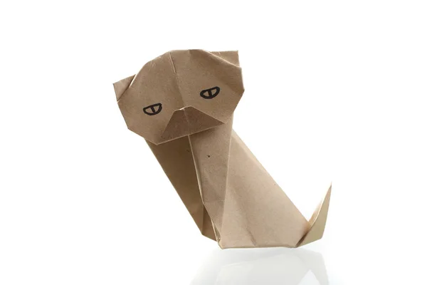 Origami cão papelaria por reciclar papel isolado em branco backgr — Fotografia de Stock