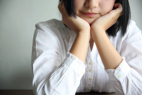 Asian young woman thinking and looking portrait in coffee shop c — Stock Photo, Image