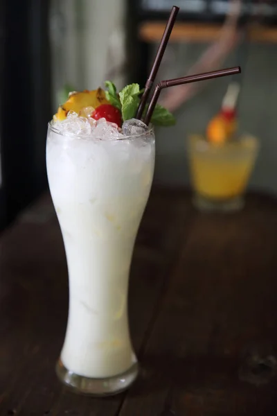 Pina colada cocktail with pineapple and cherry fruit — Stock Photo, Image