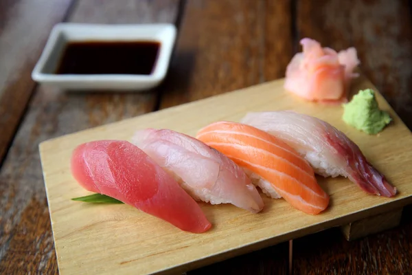 Mix sushi tuna salmon sea bass sushi on wood background japanese — Stock Photo, Image