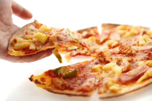 pizza , chicken green pepper pineapple on hand isolated in white