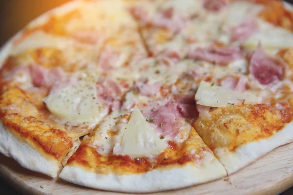 pizza hawaiian , pizza with pineapple and ham with cheese and to
