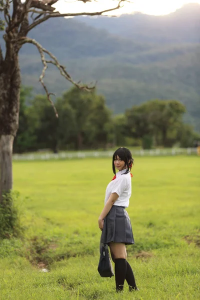 Japanese school in countryside with grass mountain and tree — Stock Photo, Image