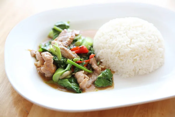 Fried pork with Chinese Kale and rice on wood background , Thai — Stock Photo, Image
