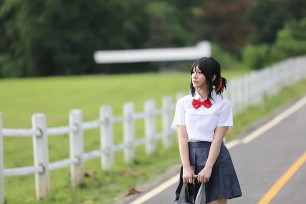 Japanese school in countryside with grass mountain and tree — Stock Photo, Image