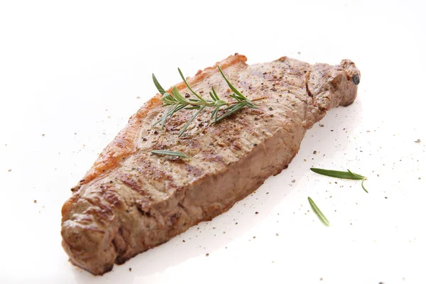 Grilled Beef Steak with pepper and rosemary isolated in white ba — Stock Photo, Image