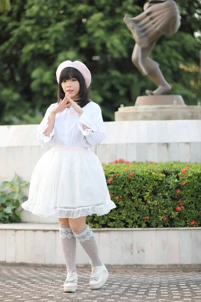 Portrait asian woman lolita dress on nature park — Stock Photo, Image