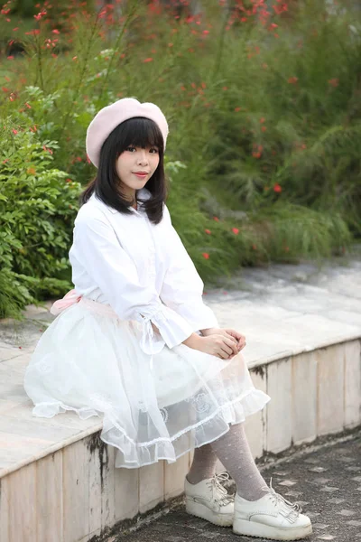 Portrait asian woman lolita dress on nature park — Stock Photo, Image