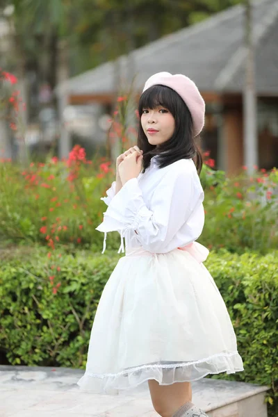 Portrait asian woman lolita dress on nature park — Stock Photo, Image