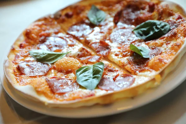Hot Pepperoni Pizza in dish, Italian food — стоковое фото