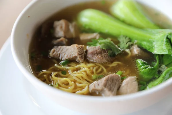 Chinese noodles with pork on wood background — Stock Photo, Image