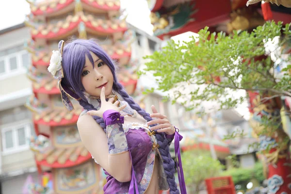 Portrait of asian young woman with purple Chinese dress cosplay — Stock Photo, Image